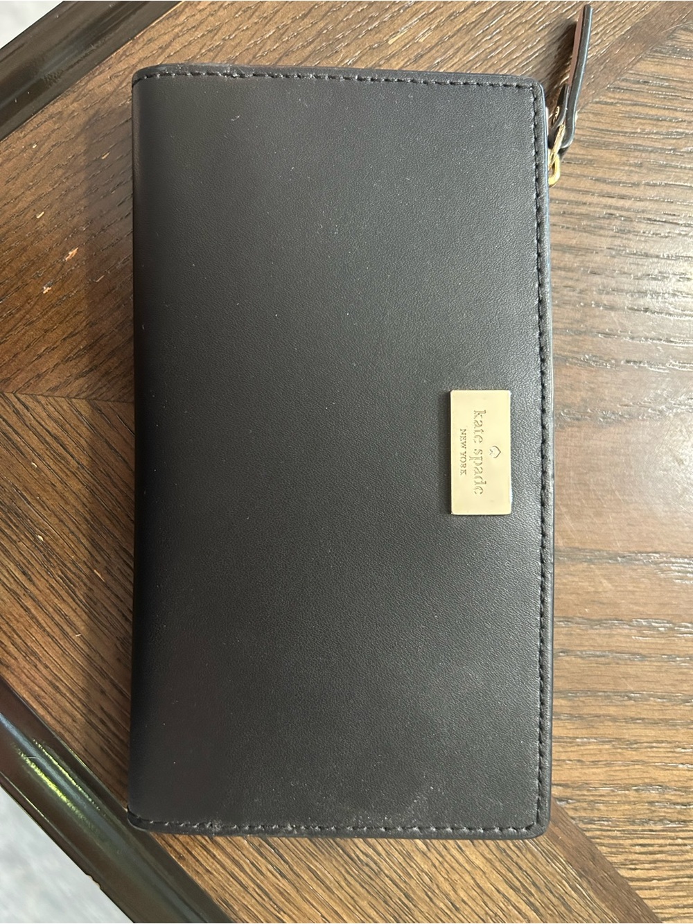 kate spade black zip-around continental wallet with gold plaque
